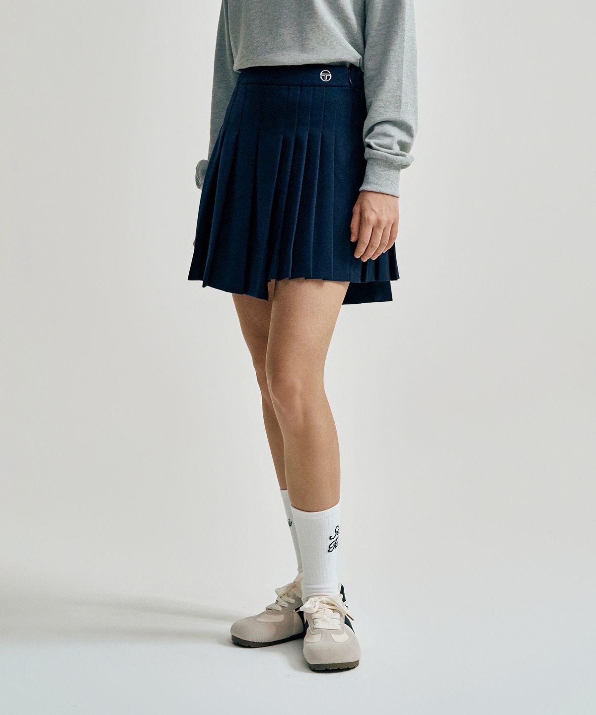 세르지오 타키니(SERGIO TACCHINI) W TR 언발란스 플리츠 스커트 (Navy)