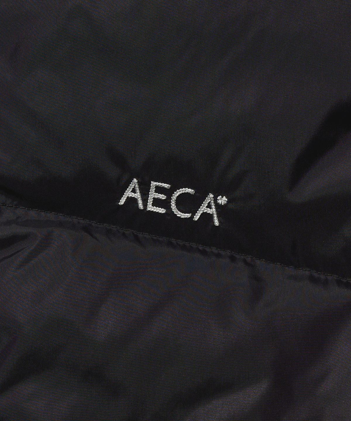 에이카화이트(AECA) AECA CURVED SHORT PUFFER JUMPER-BLACK