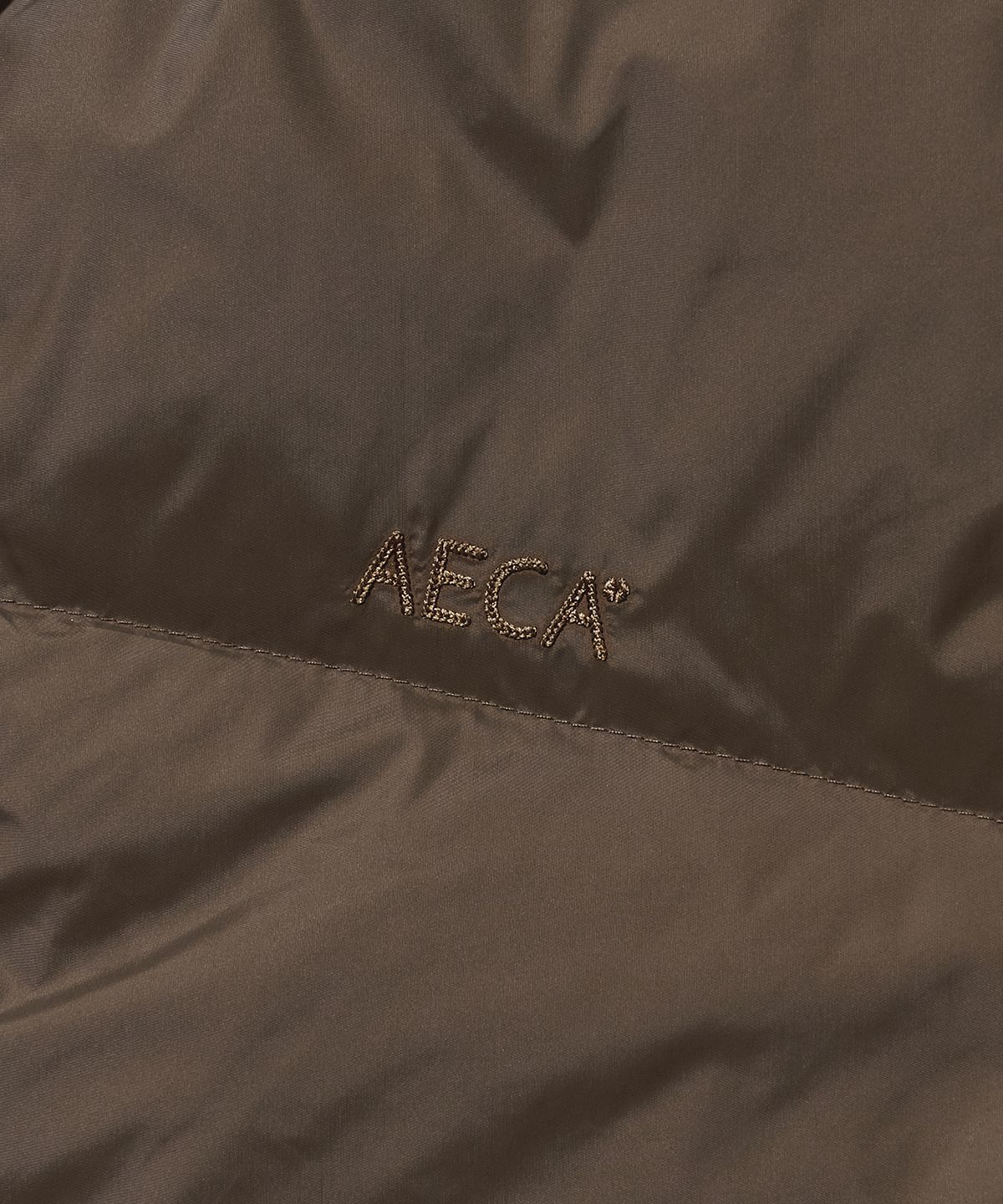 에이카화이트(AECA) AECA CURVED SHORT PUFFER JUMPER-BROWN