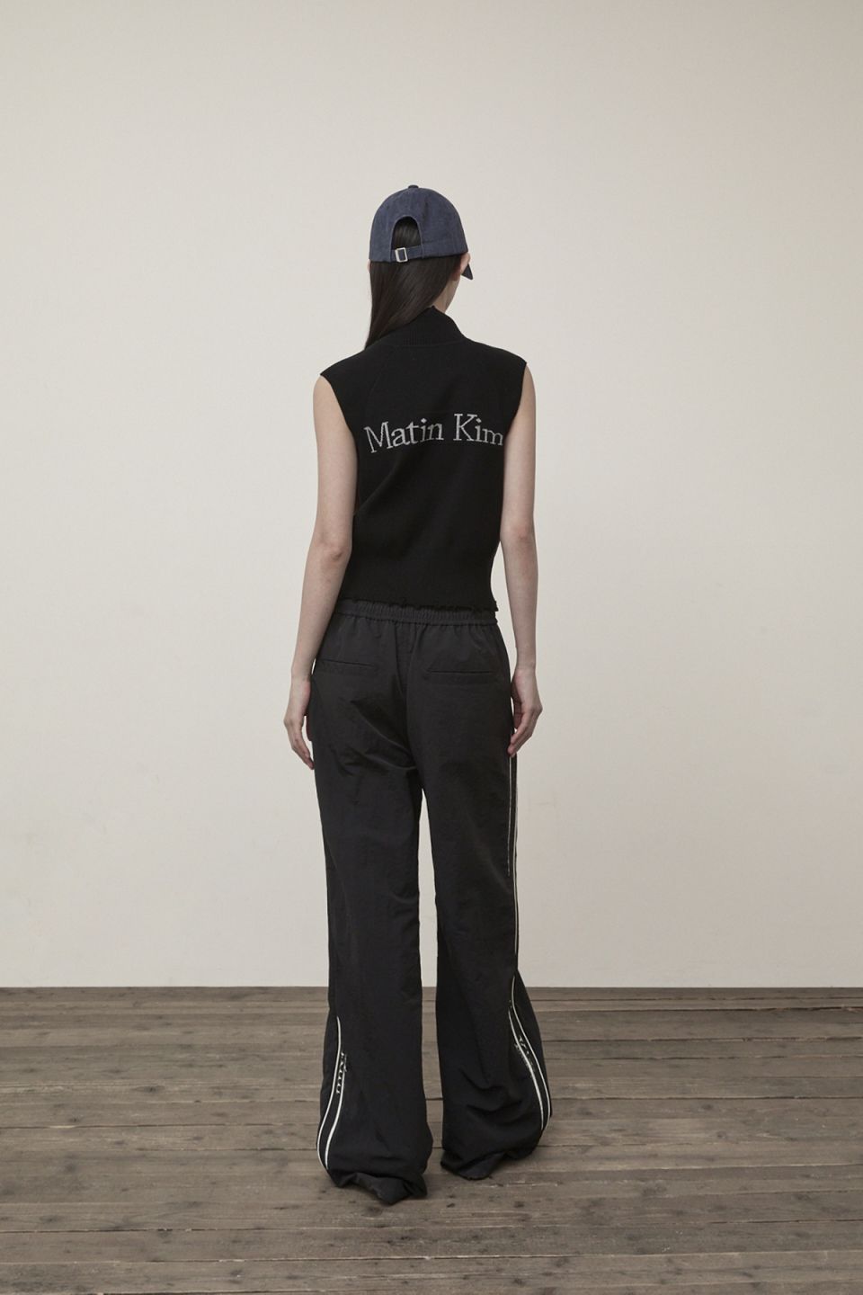 MUSINSA | MATIN KIM HIGH NECK LOGO KNIT ZIP UP VEST IN BLACK