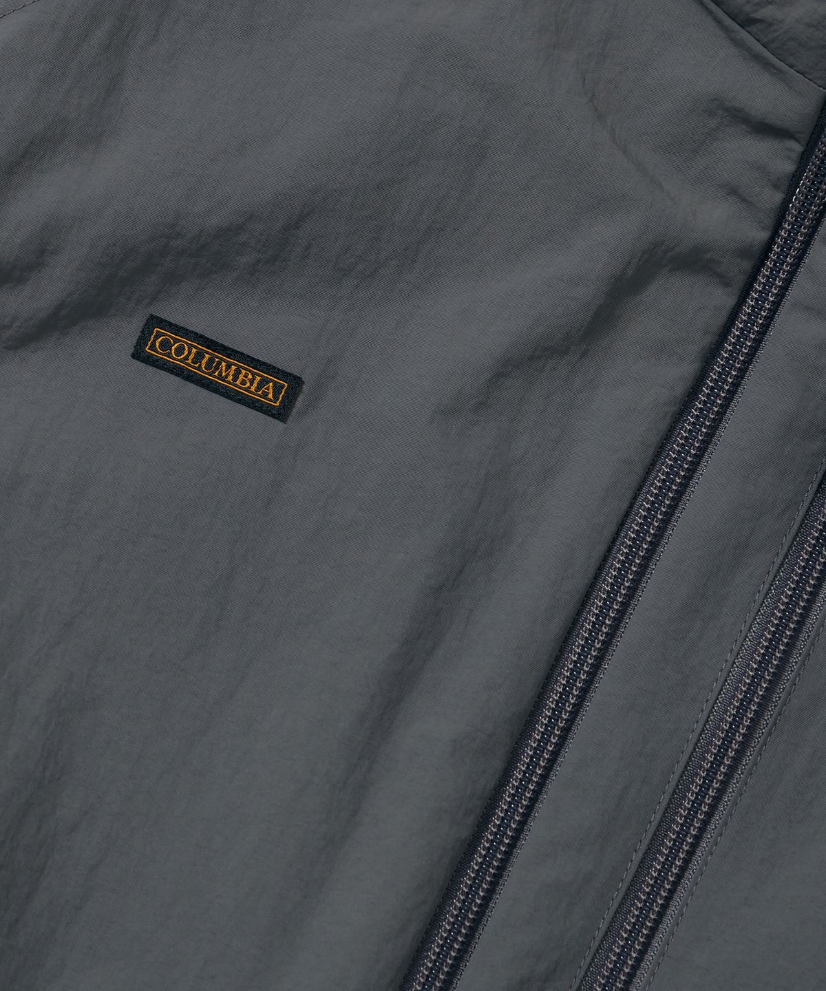 컬럼비아 유니버시티(COLUMBIA UNIVERSITY) TRAJAN LABEL REVERSIBLE NYLON/PP VEST_CHARCOAL