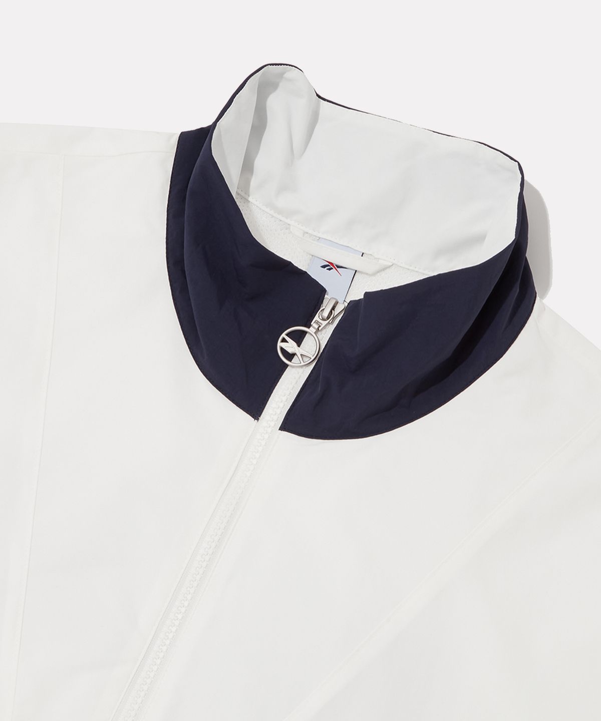 리복(REEBOK) 헤리티지 아노락 자켓 - 오프화이트