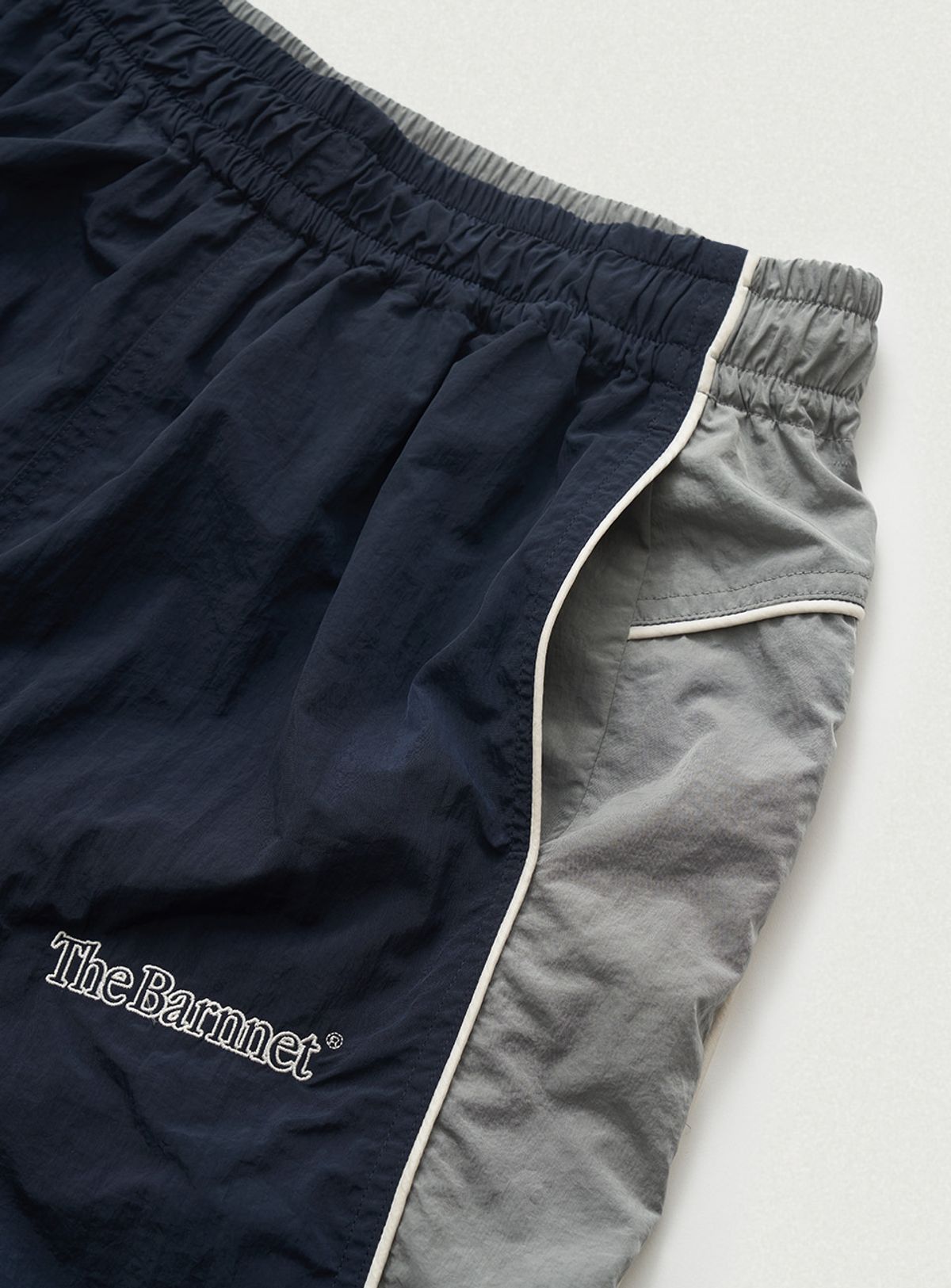 더바넷(THEBARNNET) Tovi Wind Set-Up Pants_Navy