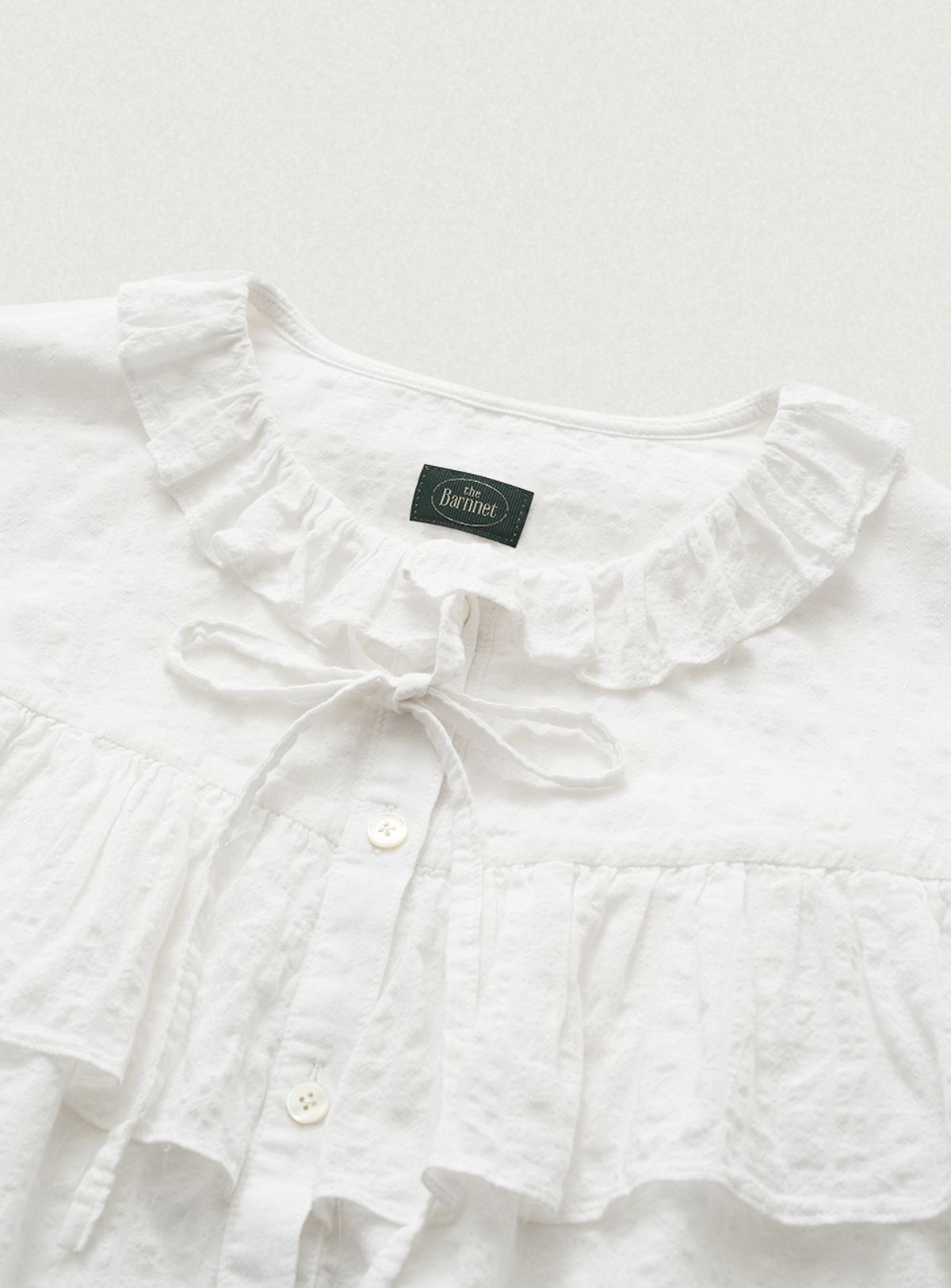 더바넷(THEBARNNET) Panele Check Ruffled Blouse_Ivory