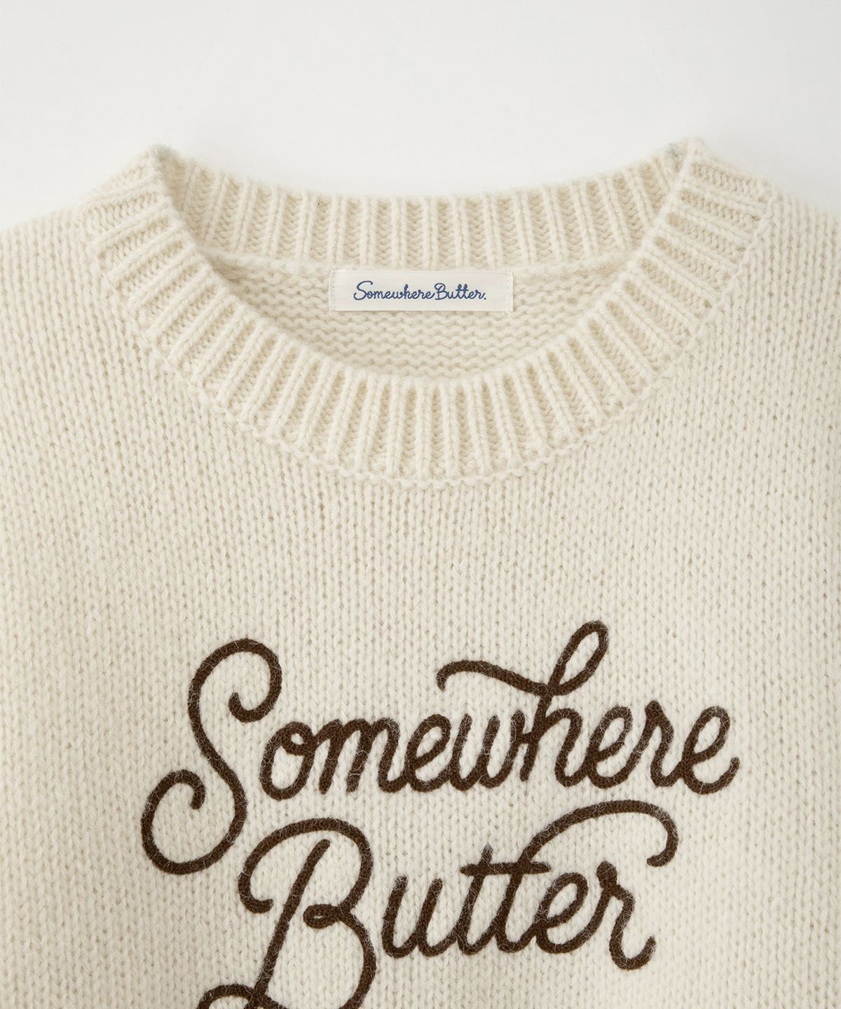 썸웨어버터(SOMEWHEREBUTTER) Boucle Heart Wool Knit - Ivory