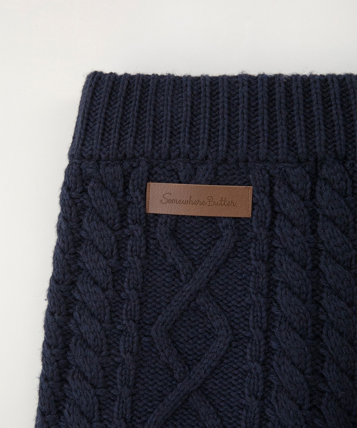 썸웨어버터(SOMEWHEREBUTTER) Wool Cable Knit Pants - Navy