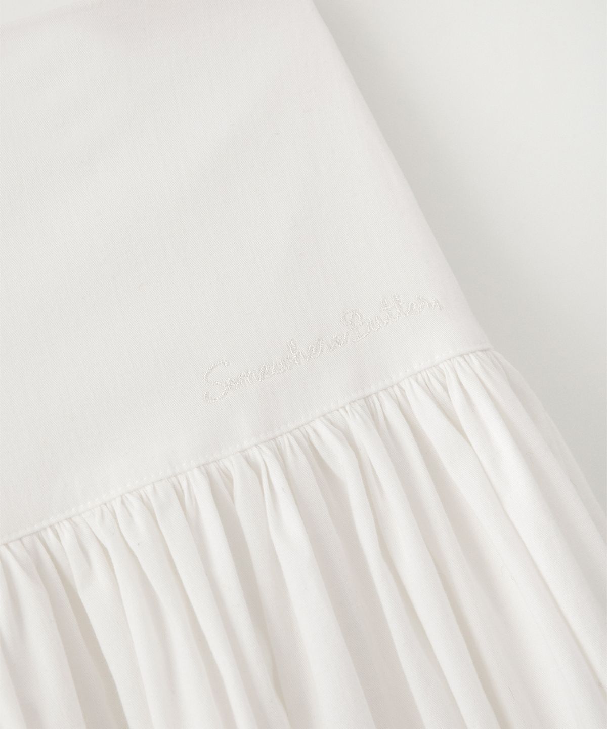 썸웨어버터(SOMEWHEREBUTTER) Button Shirring Long Skirt - Ivory