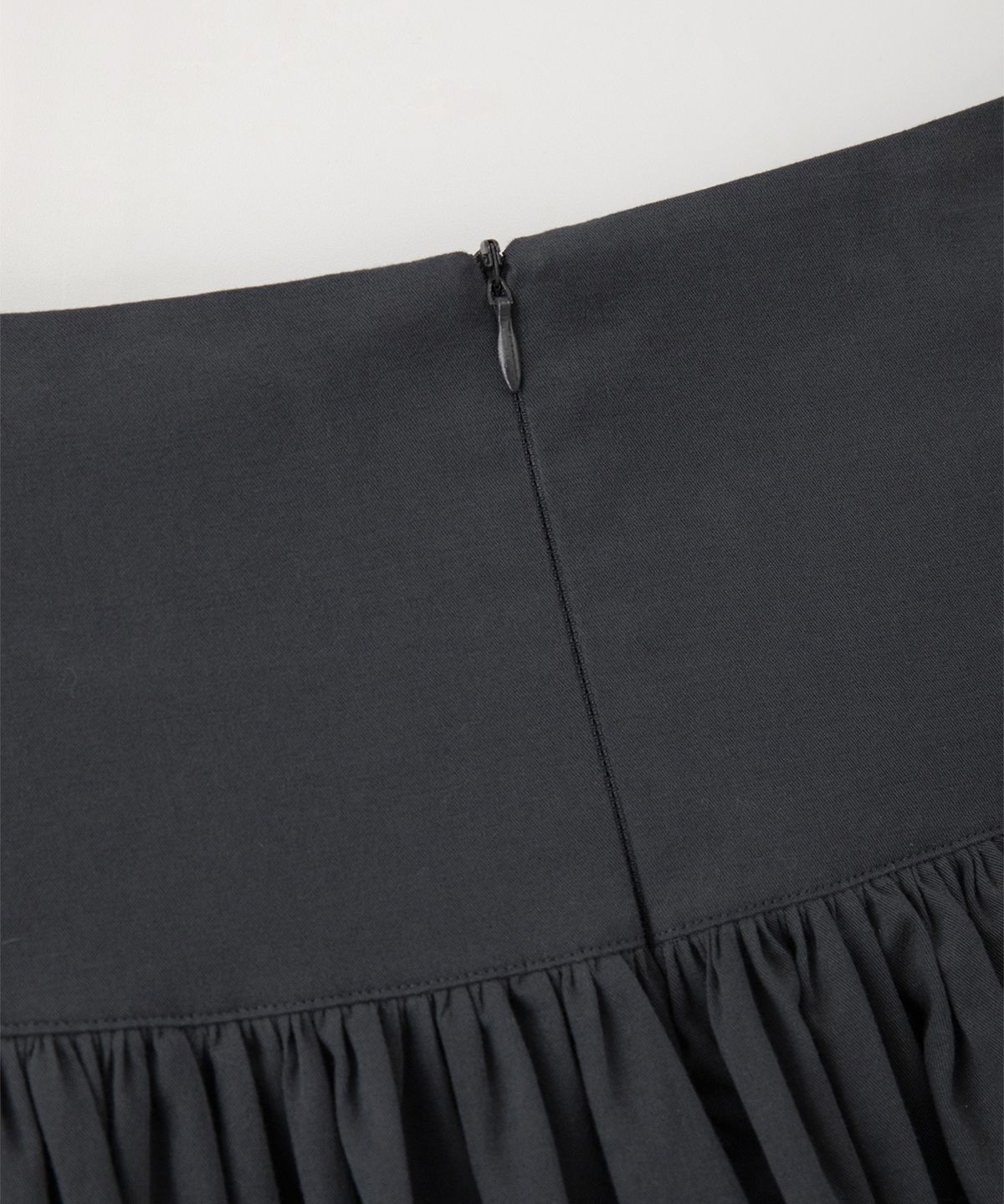 썸웨어버터(SOMEWHEREBUTTER) Button Shirring Long Skirt - Charcoal