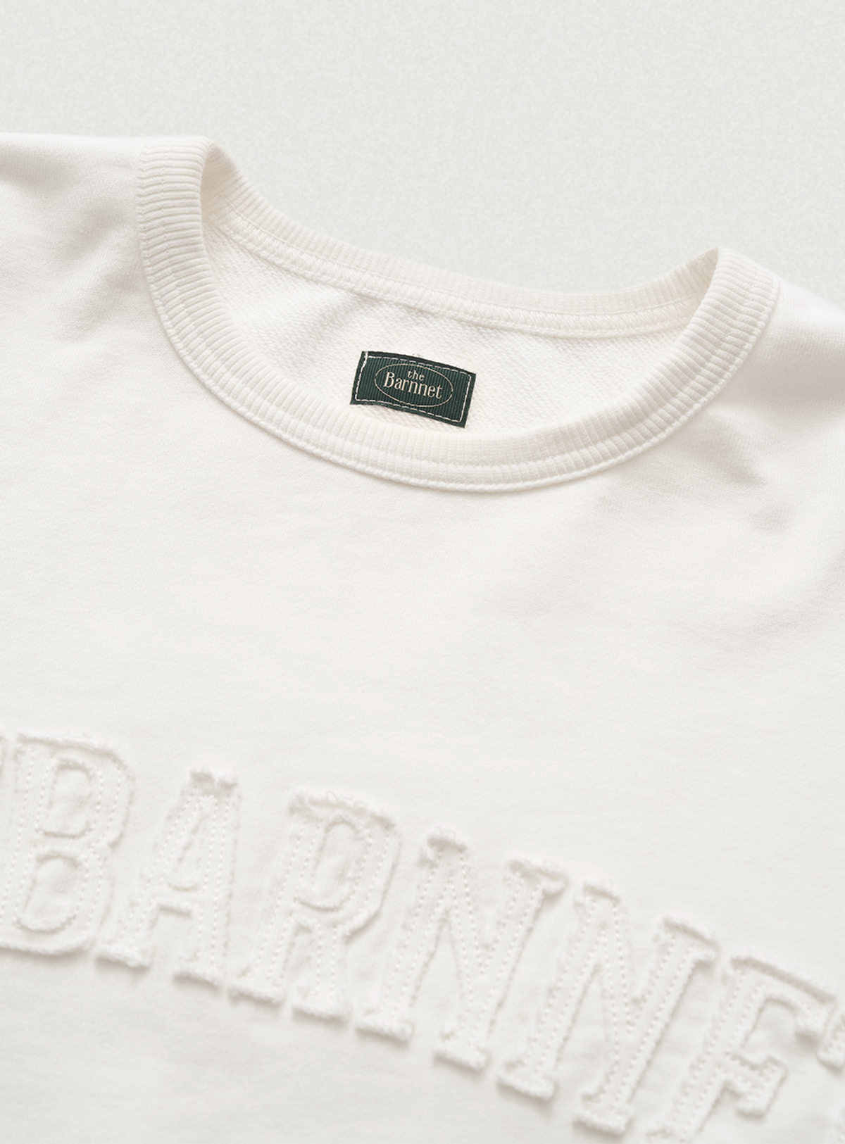 더바넷(THEBARNNET) Oversized Crest Logo Sweat Shirt