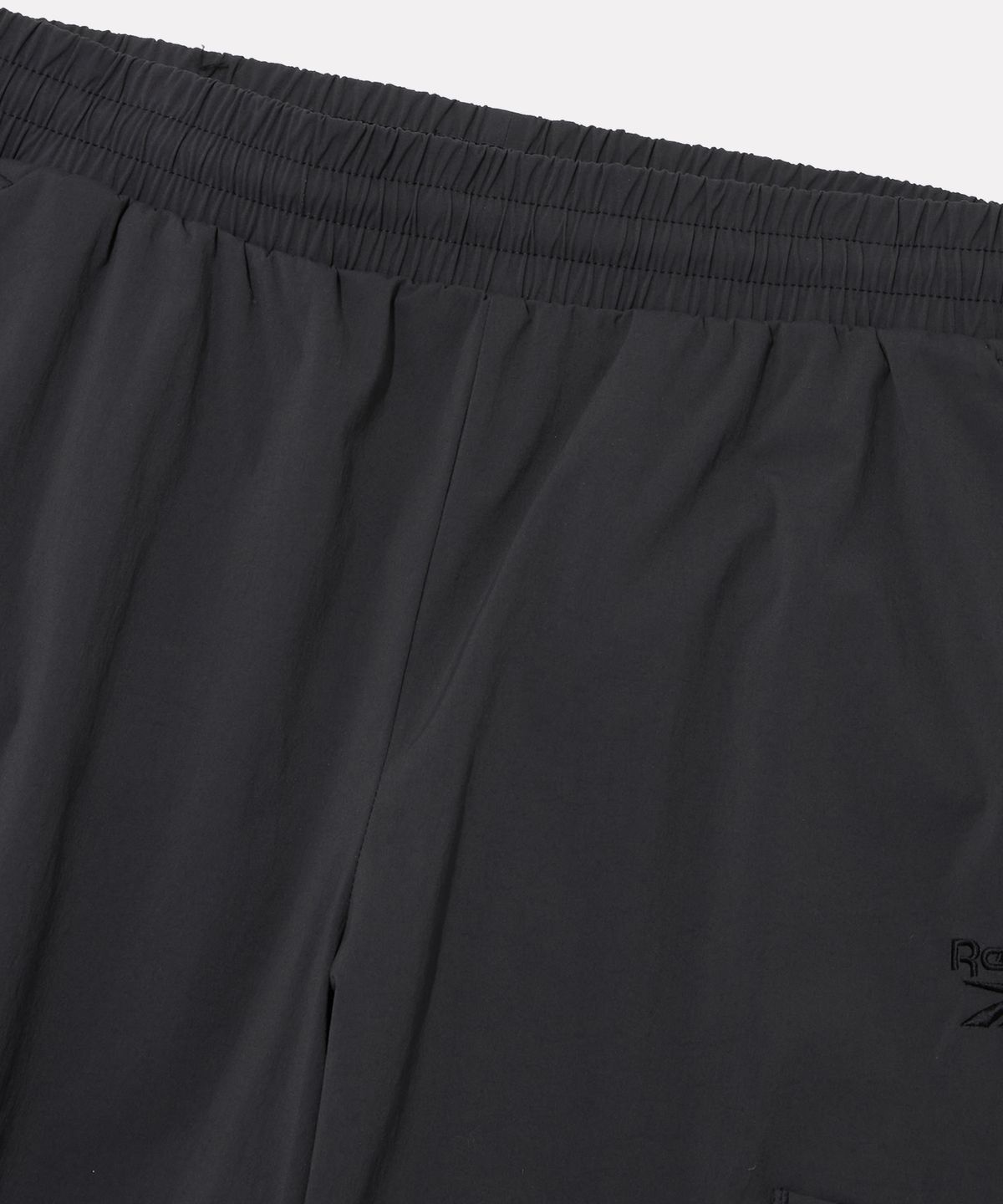 리복(REEBOK) 나일론 스트레치 카고 조거 팬츠 - 차콜