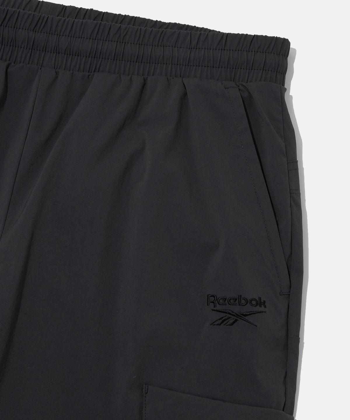리복(REEBOK) 나일론 스트레치 카고 조거 팬츠 - 차콜