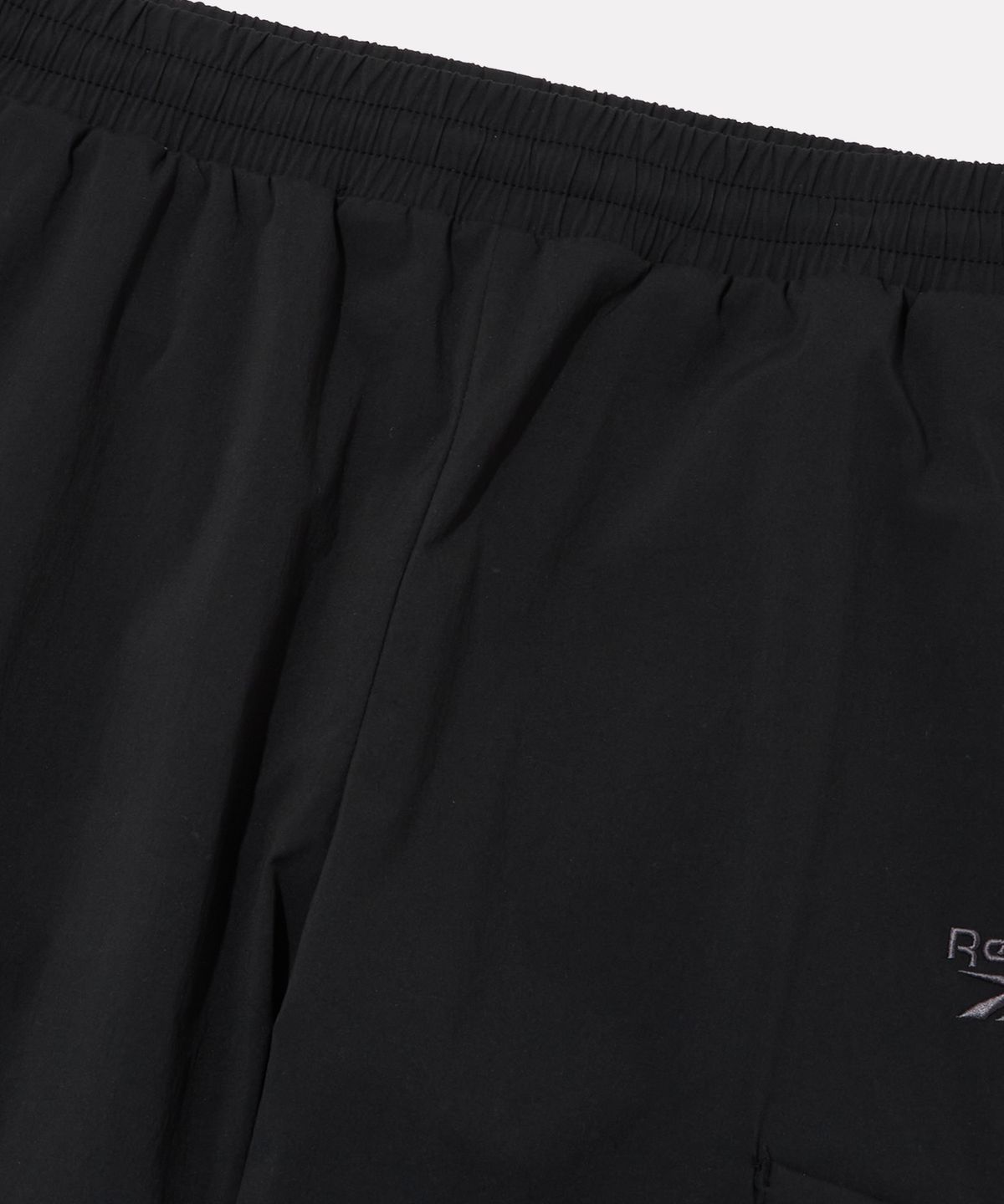 리복(REEBOK) 나일론 스트레치 카고 조거 팬츠 - 블랙