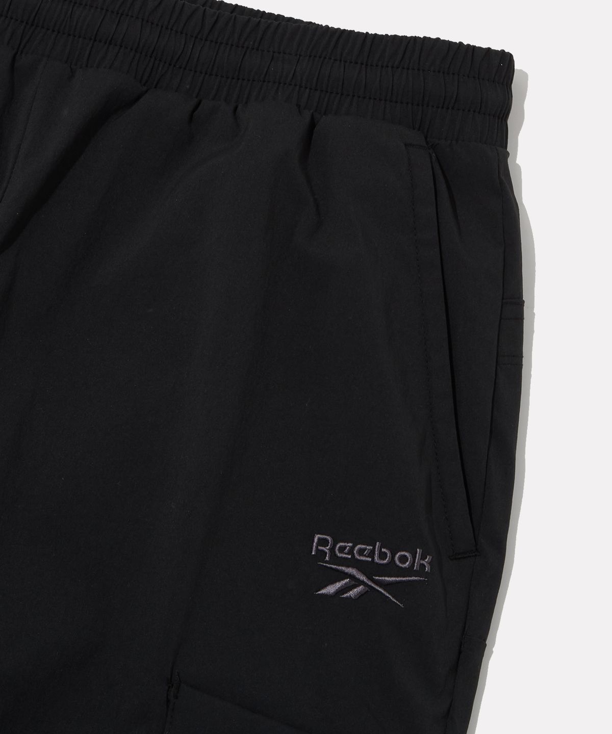 리복(REEBOK) 나일론 스트레치 카고 조거 팬츠 - 블랙