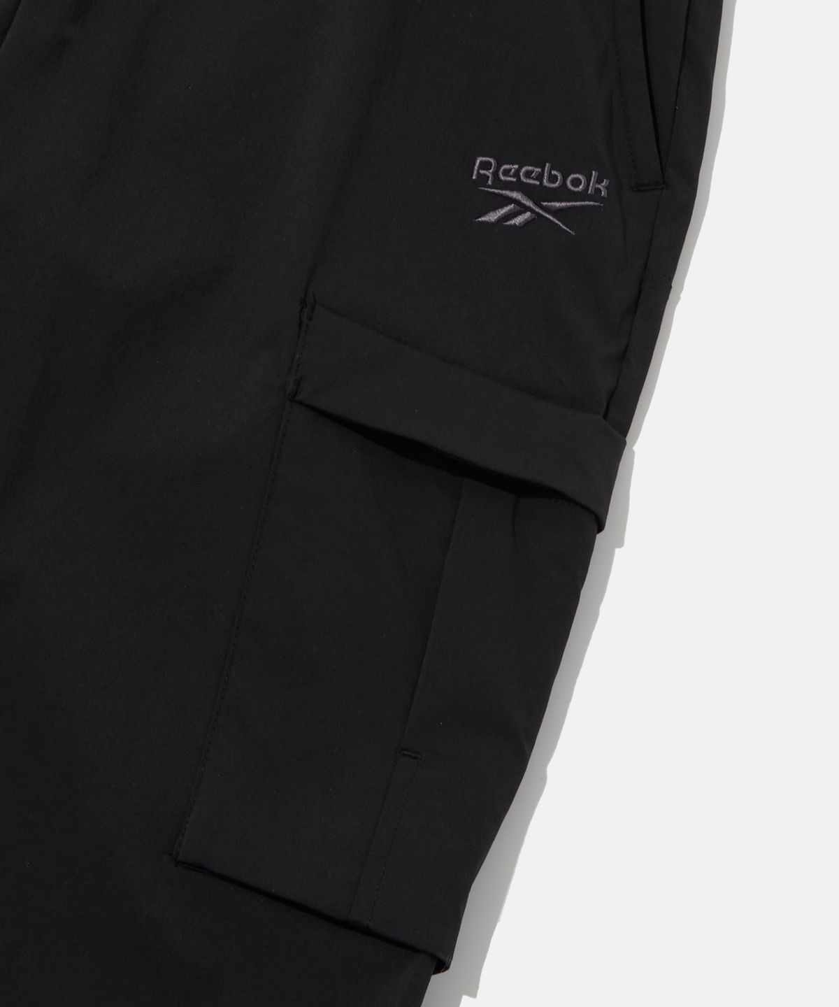 리복(REEBOK) 나일론 스트레치 카고 조거 팬츠 - 블랙