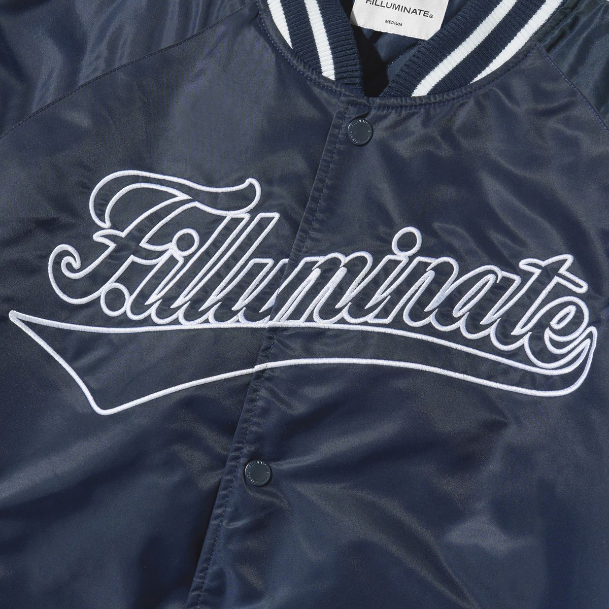 필루미네이트(FILLUMINATE) 커브드 로고 바시티 자켓-네이비