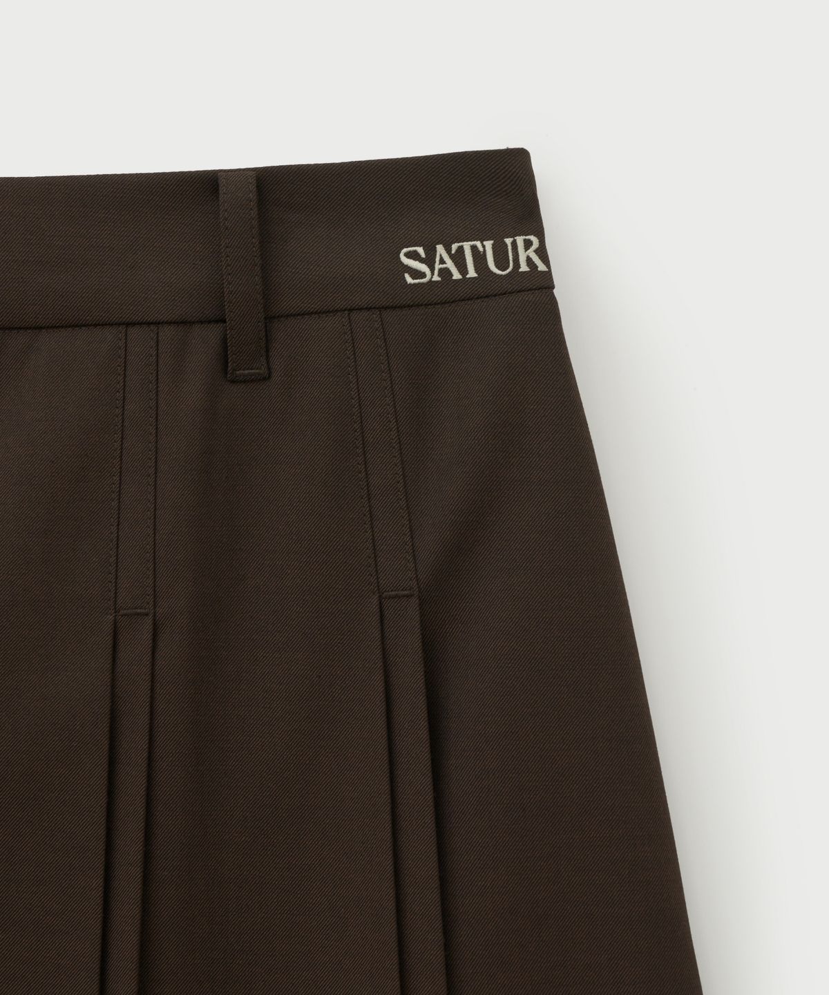 세터(SATUR) (W) 버튼 플리츠 미디 스커트 브라운