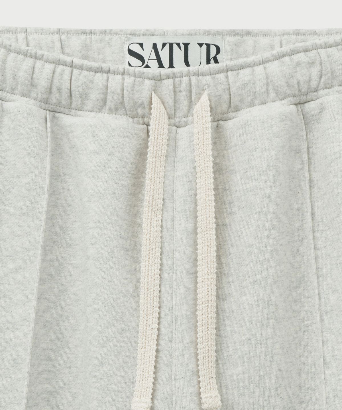 세터(SATUR) S 로고 조거 스웨트팬츠 멜란지 아이보리