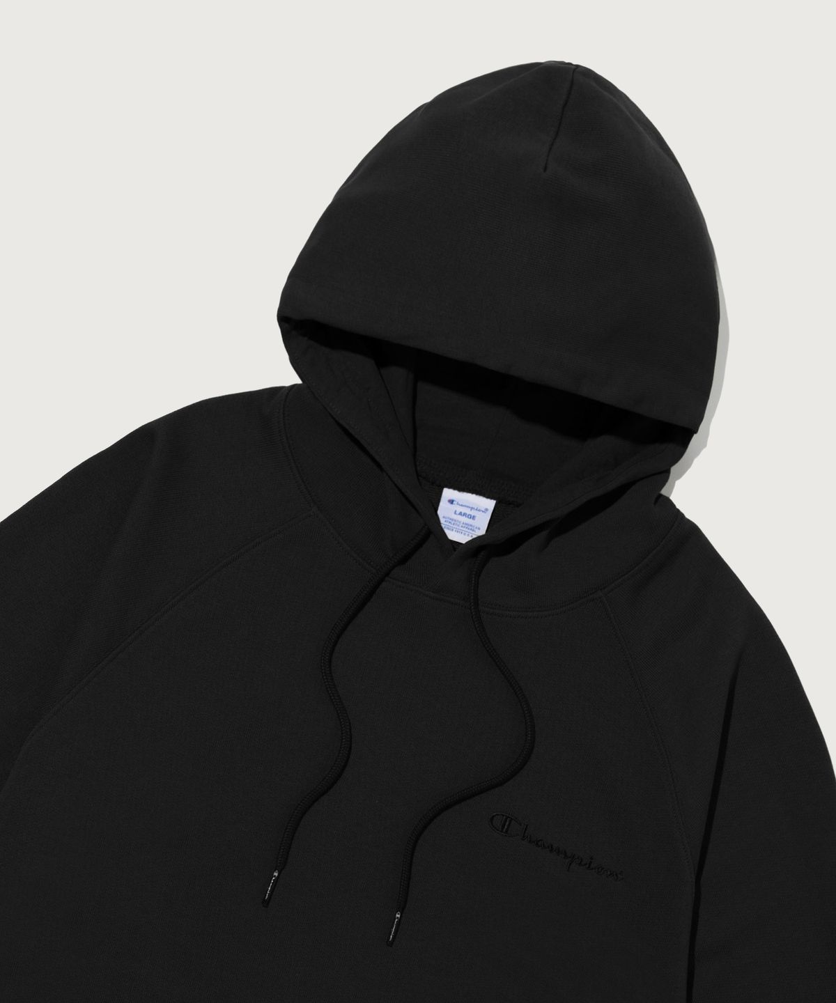챔피온(CHAMPION) 스몰 로고 루즈핏 후드 티셔츠 Black