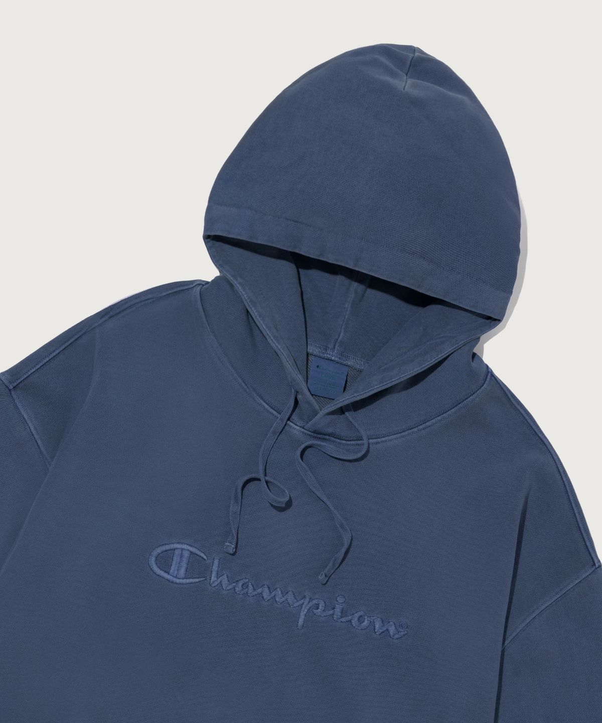챔피온(CHAMPION) 빅 로고 피그먼트 오버핏 후드 티셔츠 Blue