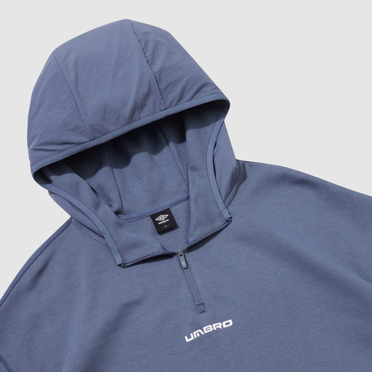 엄브로(UMBRO) 나이트런 하이브리드 후드 하프 집업 블루(UQ321SHD91)