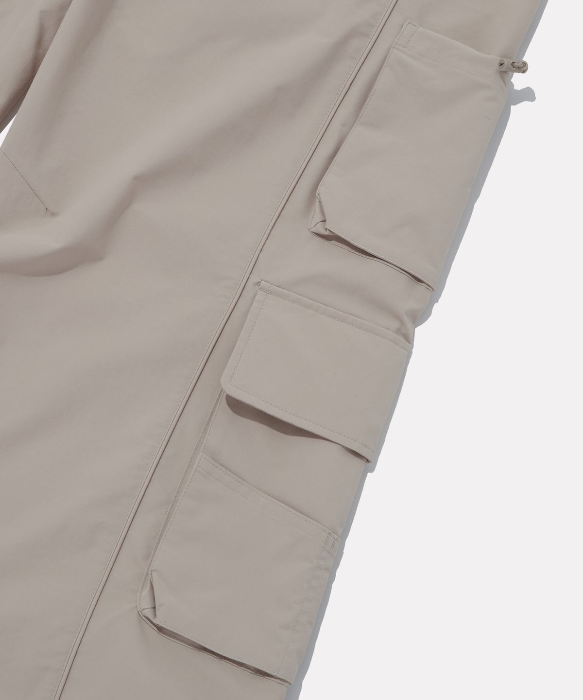 리복(REEBOK) 멀티 포켓 카고 팬츠 (W) - 아이보리