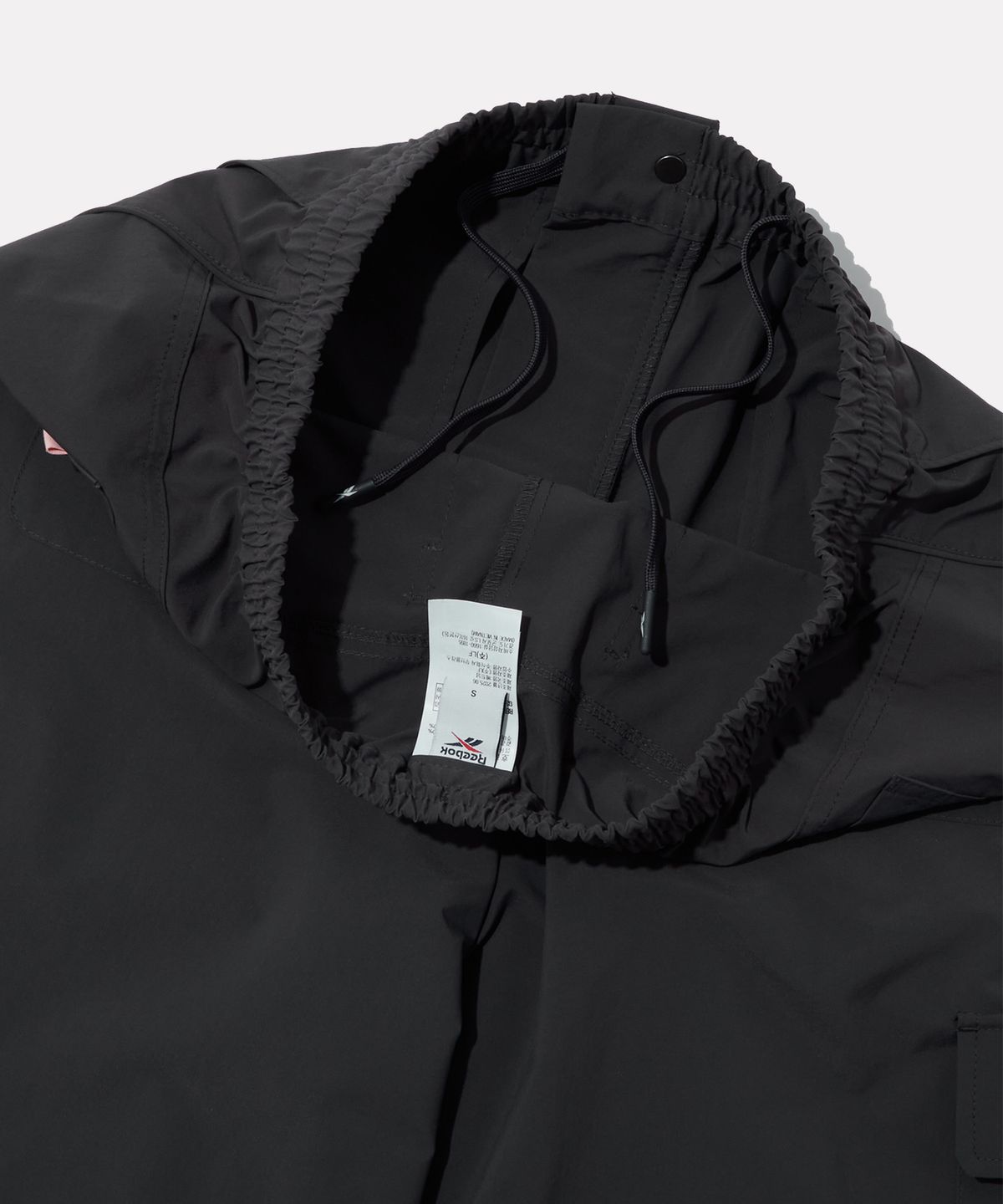 리복(REEBOK) 멀티 포켓 카고 팬츠 (W) - 차콜