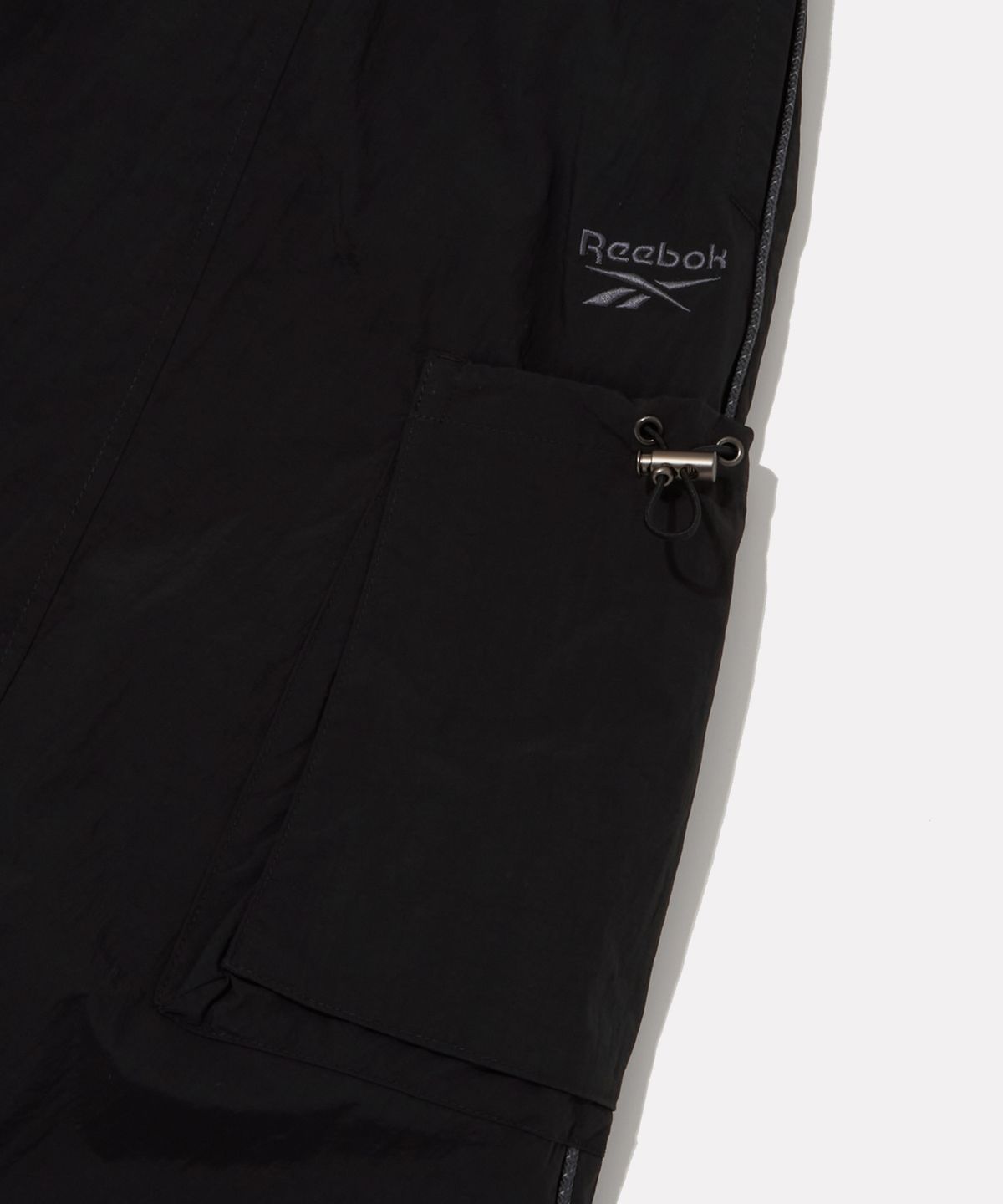 리복(REEBOK) 나일론 포켓 스커트 (W) - 블랙