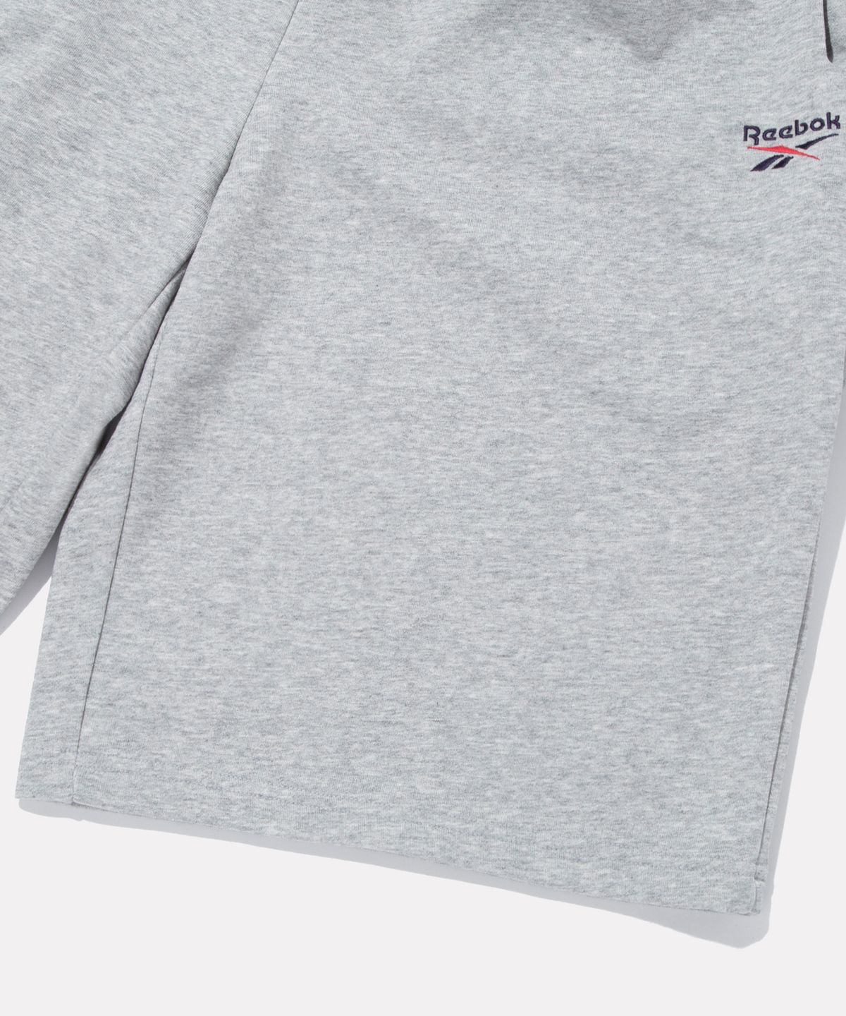 리복(REEBOK) 스웨트 버뮤다 쇼츠 - 그레이