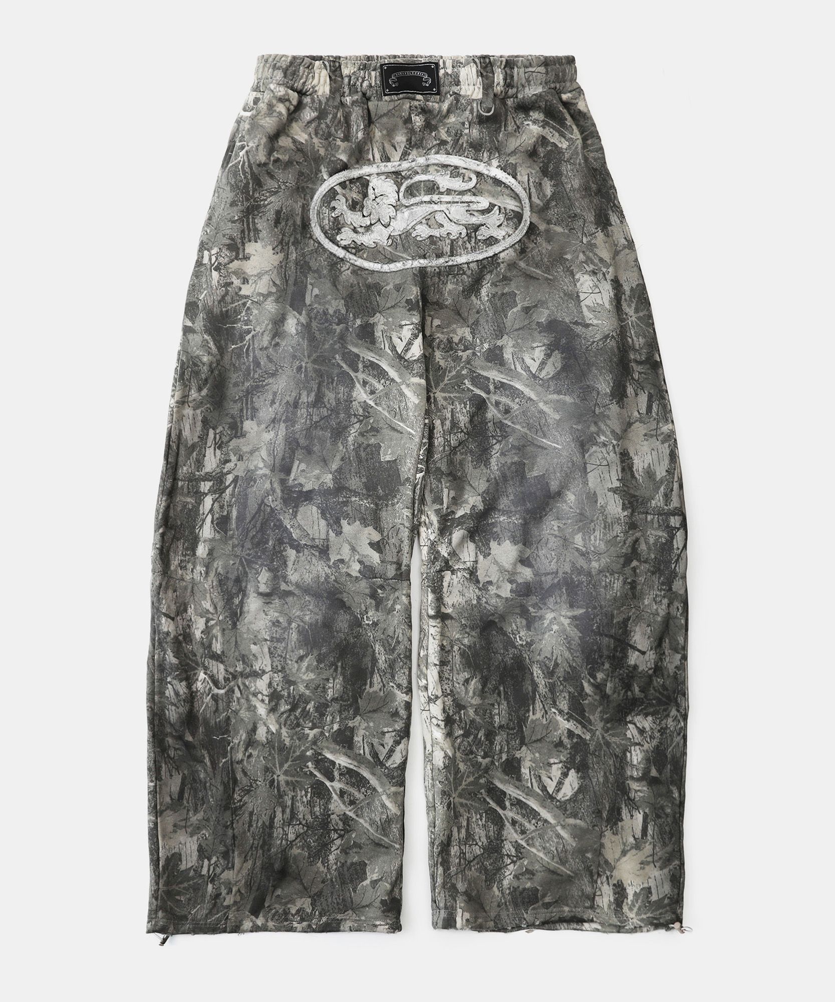 MUSINSA | BADBLOOD Lion Patch 2 Way Curved Jogger - Light Realtree
