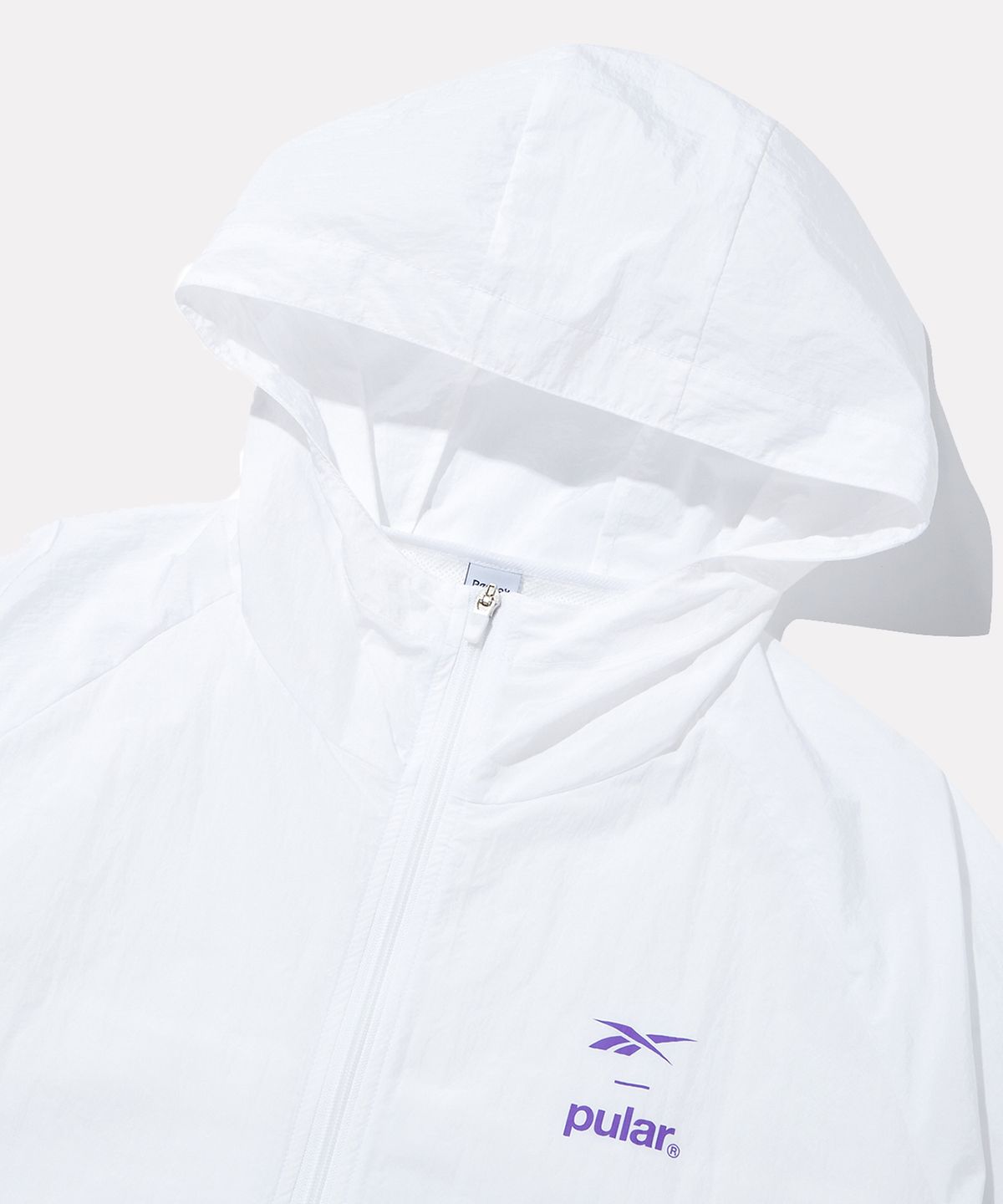 리복(REEBOK) Reebok X Pular 러닝 경량 윈드브레이커 - 화이트