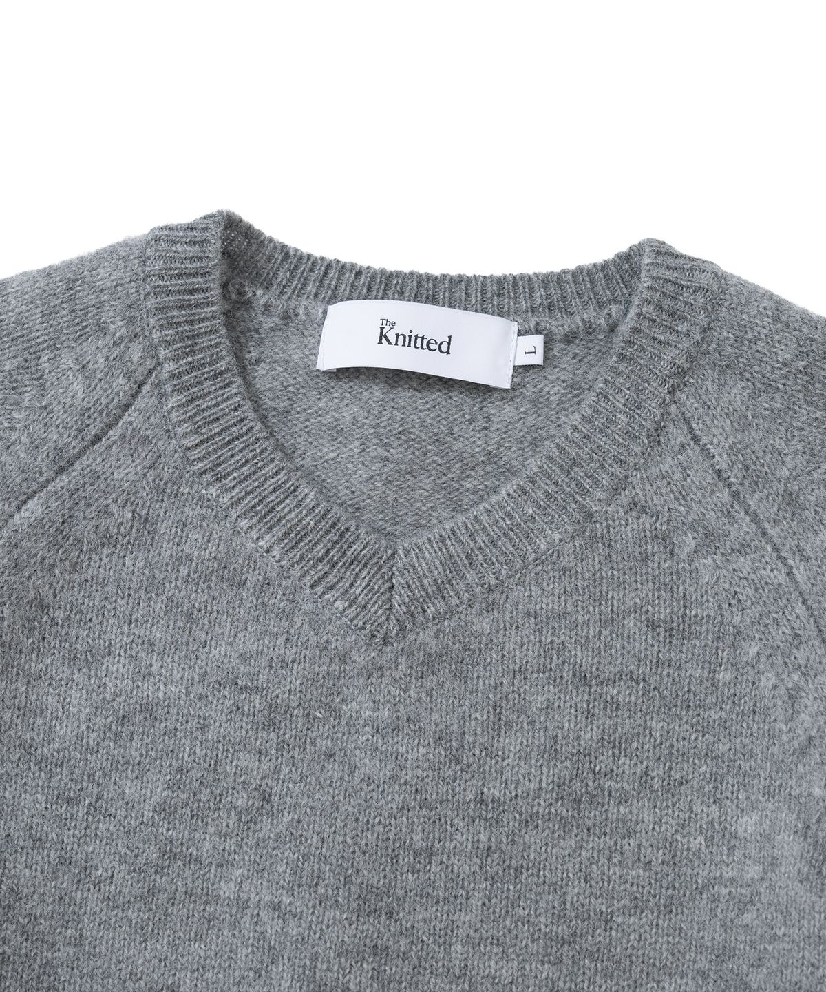 니티드(KNITTED) 쉐기독 울 100% 브이넥 니트 MELANGE GREY