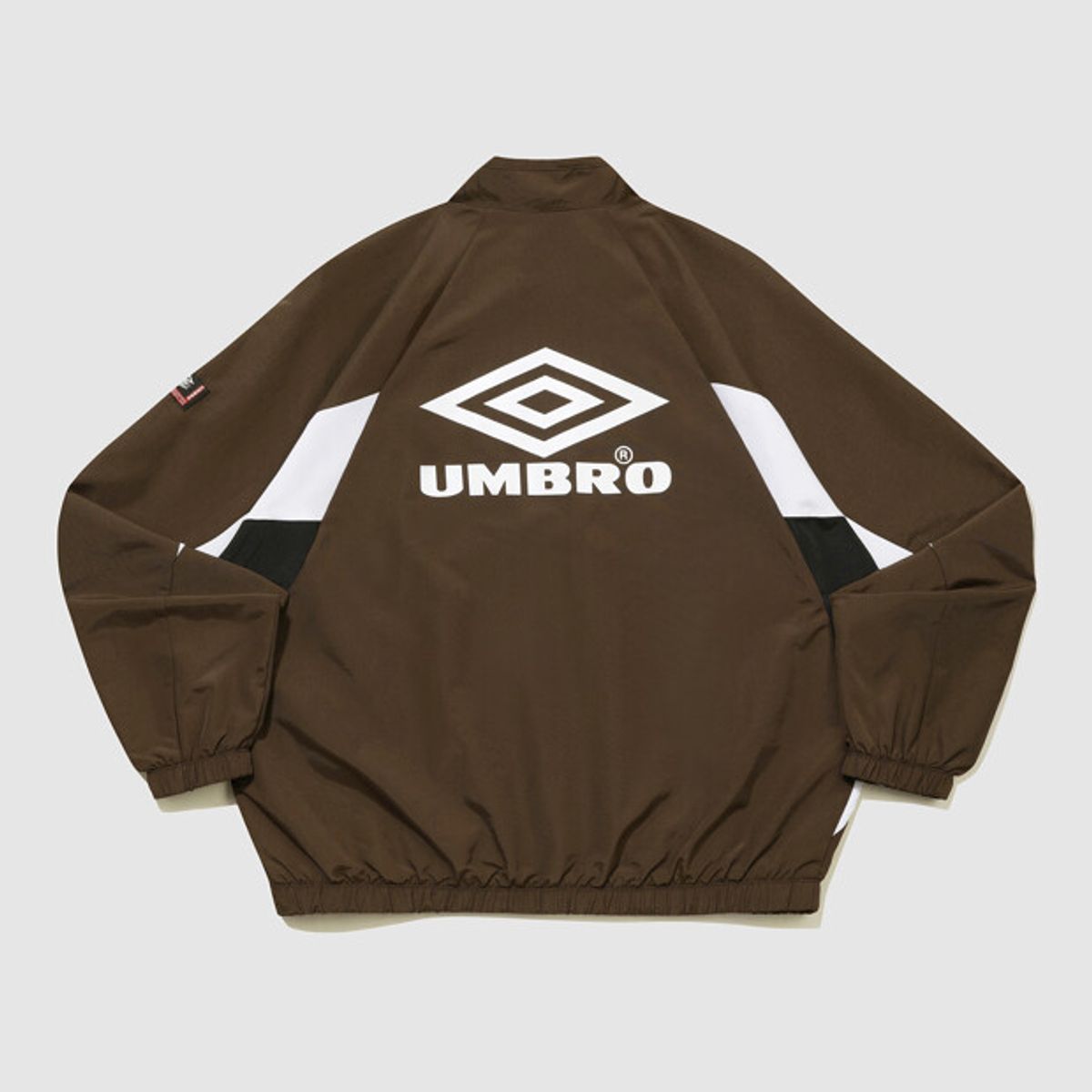 엄브로(UMBRO) HBL OG 헤리티지 스탠넥 바람막이 자켓 브라운(UQ321CJK97)
