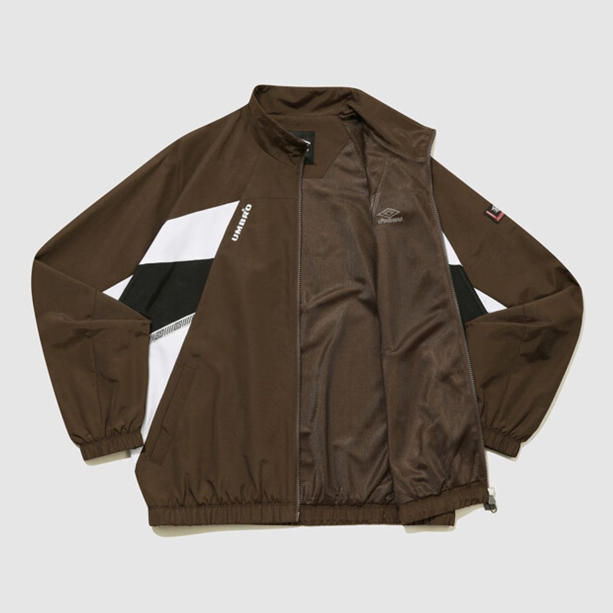엄브로(UMBRO) HBL OG 헤리티지 스탠넥 바람막이 자켓 브라운(UQ321CJK97)