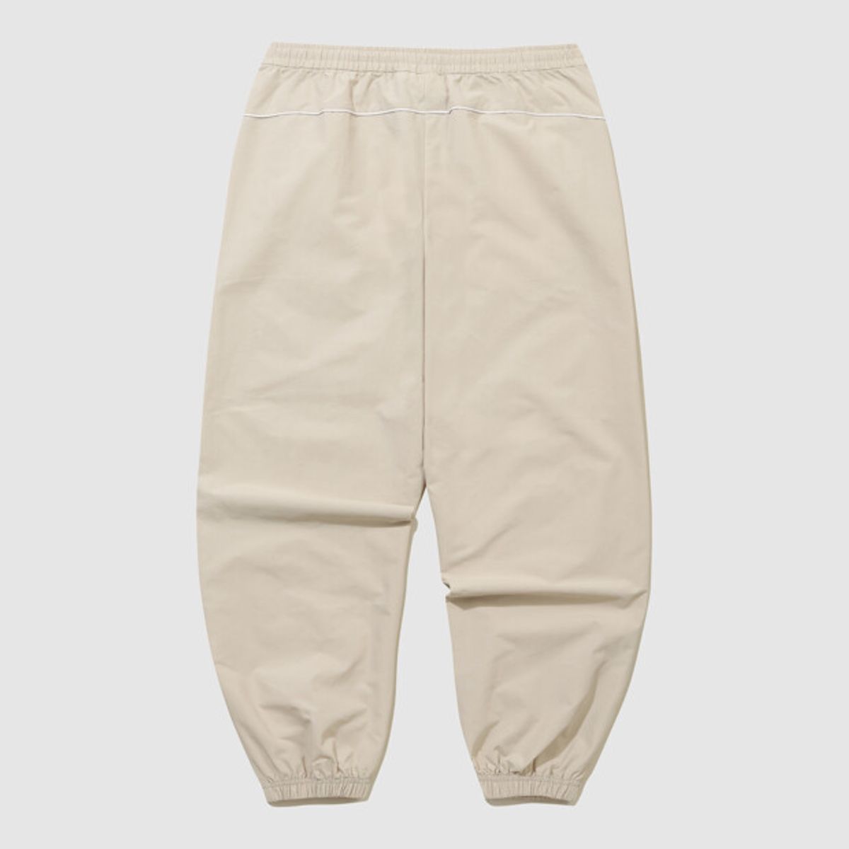 엄브로(UMBRO) HBL 엔지니어드 크루 우븐 조거 팬츠 베이지(UQ323CPT97)