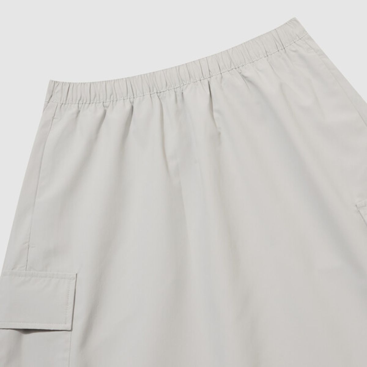 엄브로(UMBRO) HBL 로얄 컬리지 우먼스 플레어 스커트 라이트 그레이(UQ322CSK92)