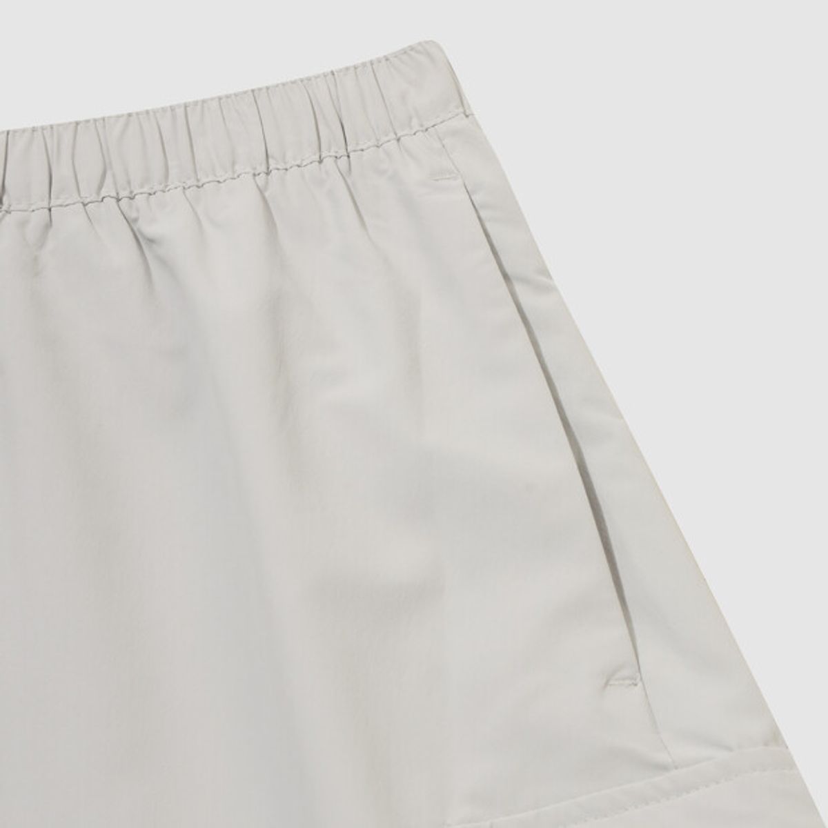 엄브로(UMBRO) HBL 로얄 컬리지 우먼스 플레어 스커트 라이트 그레이(UQ322CSK92)
