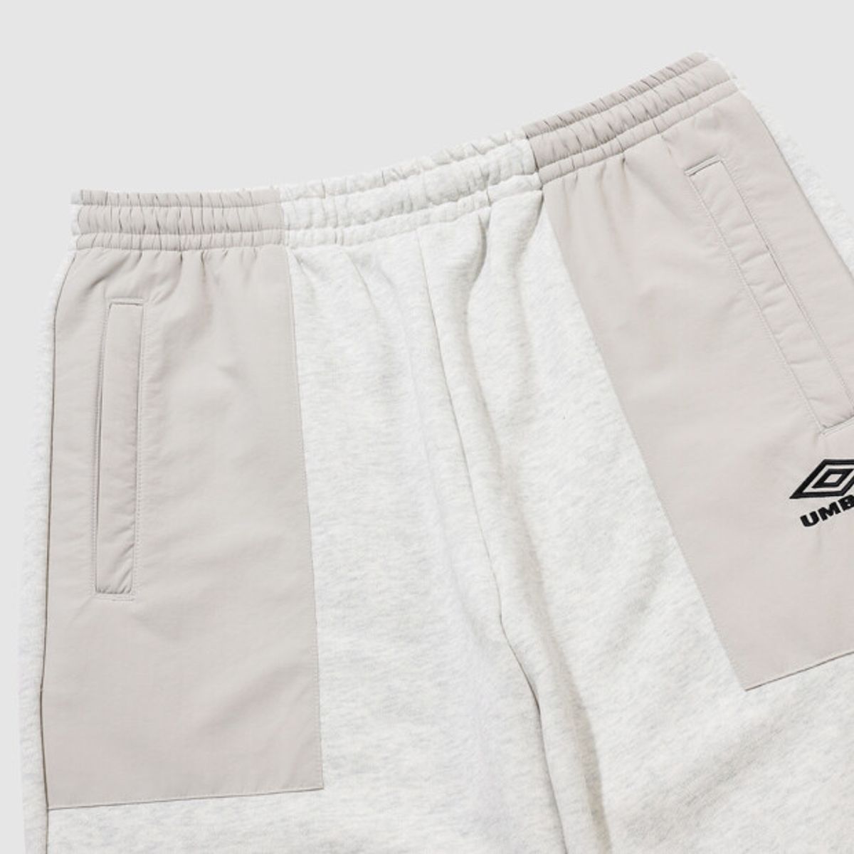 엄브로(UMBRO) HBL 하이브리드 니트 조거 팬츠 아이보리(UQ321CFP97)