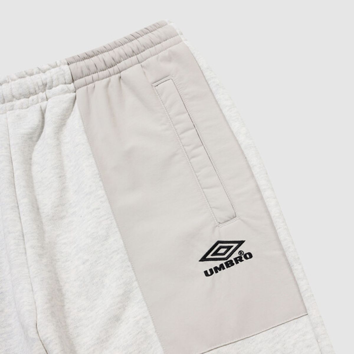 엄브로(UMBRO) HBL 하이브리드 니트 조거 팬츠 아이보리(UQ321CFP97)