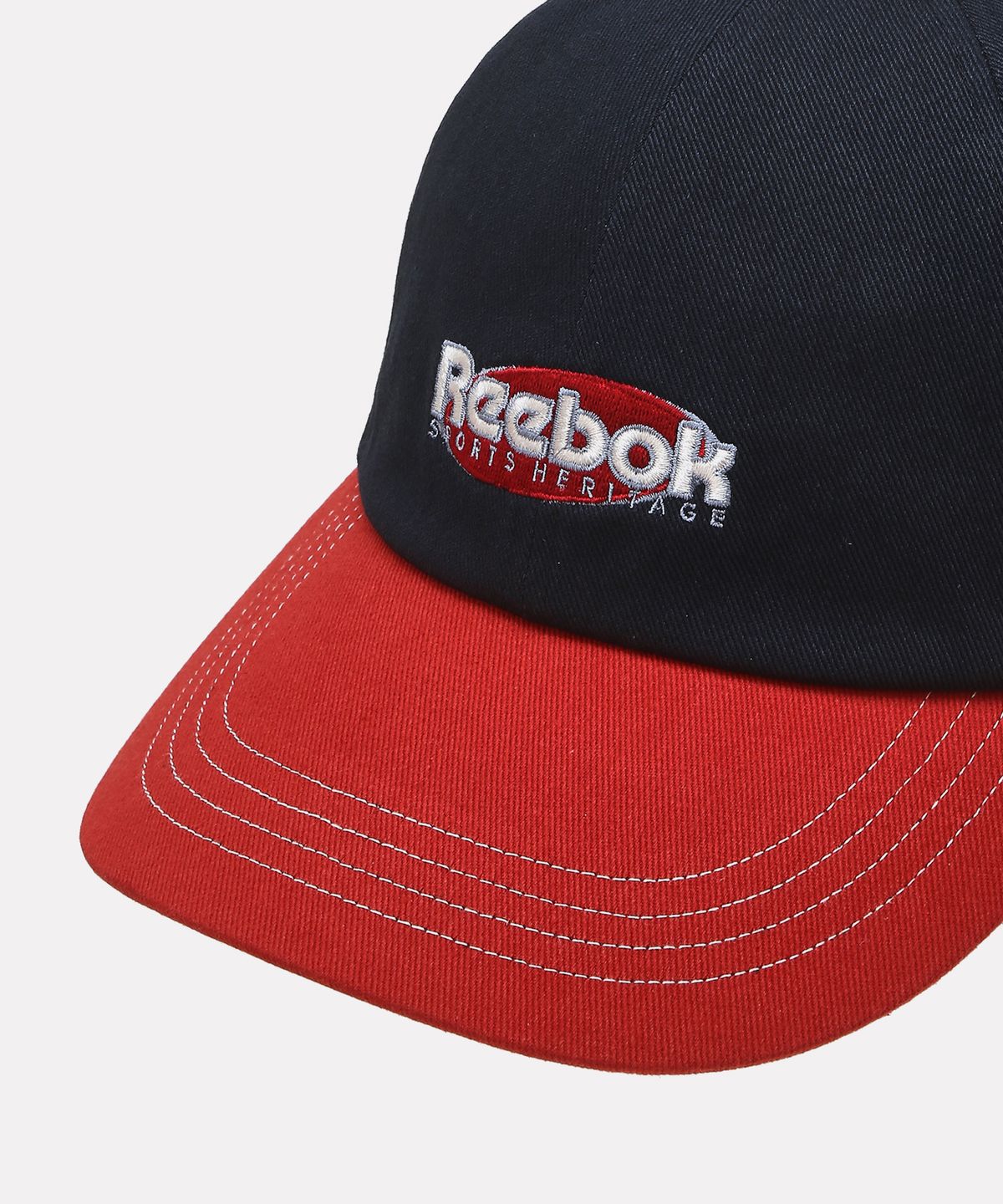 리복(REEBOK) 투톤 로고 볼캡 - 네이비:레드