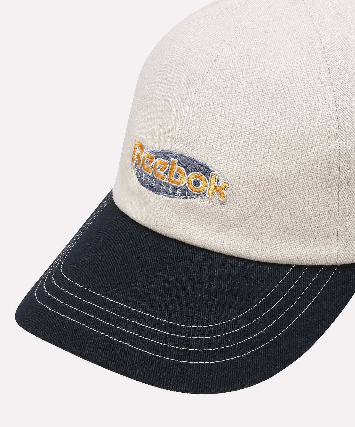 리복(REEBOK) 투톤 로고 볼캡 - 아이보리:네이비