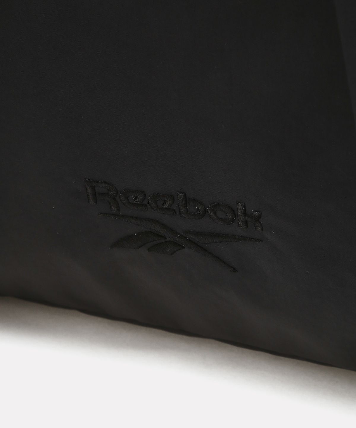 리복(REEBOK) 컬러 블록 스트링 백팩 - 다크 레드