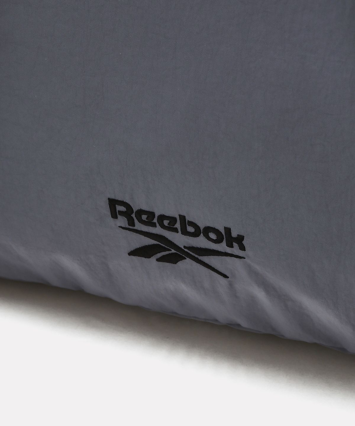 리복(REEBOK) 컬러 블록 스트링 백팩 - 라이트 그레이