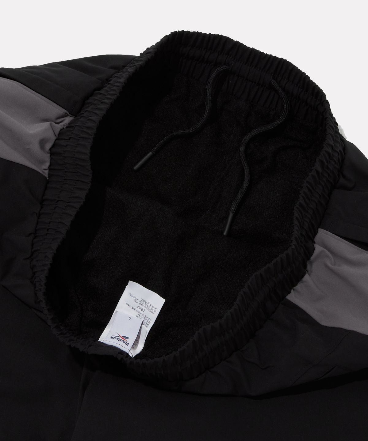 리복(REEBOK) 프리미어 웜 메쉬 스트링 팬츠 - 블랙
