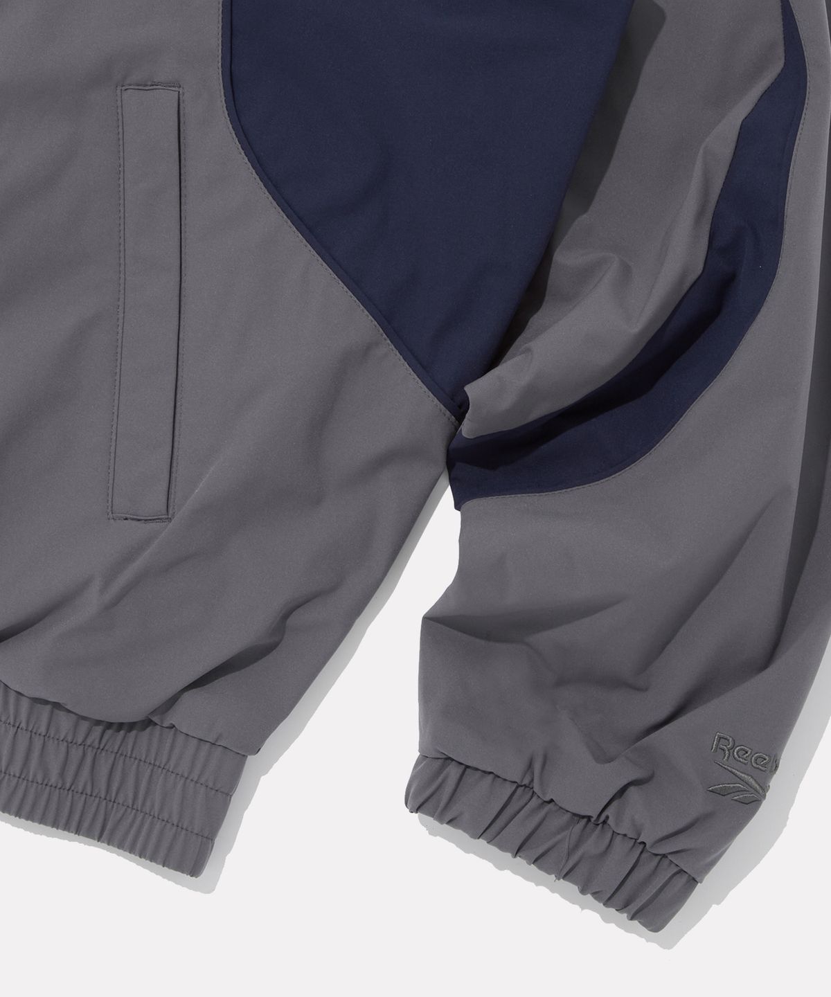 리복(REEBOK) 프리미어 웜 메쉬 윈드 브레이커 - 그레이