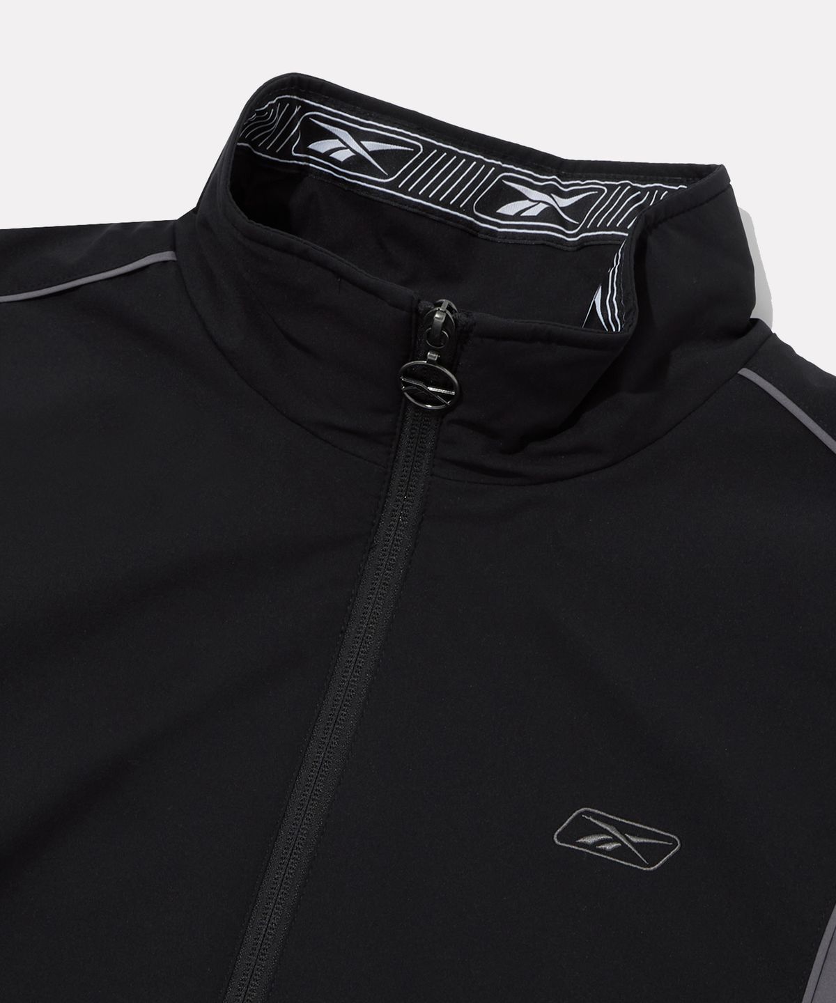 리복(REEBOK) 프리미어 웜 메쉬 윈드 브레이커 - 블랙