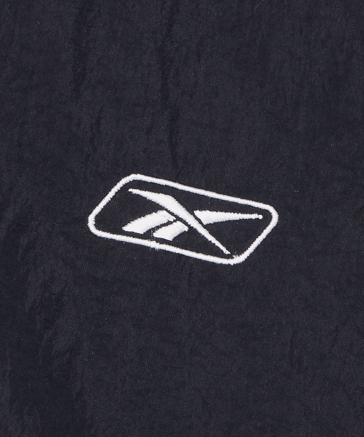 리복(REEBOK) 프리미어 크롭 트랙 경량 패딩 (W) - 블랙