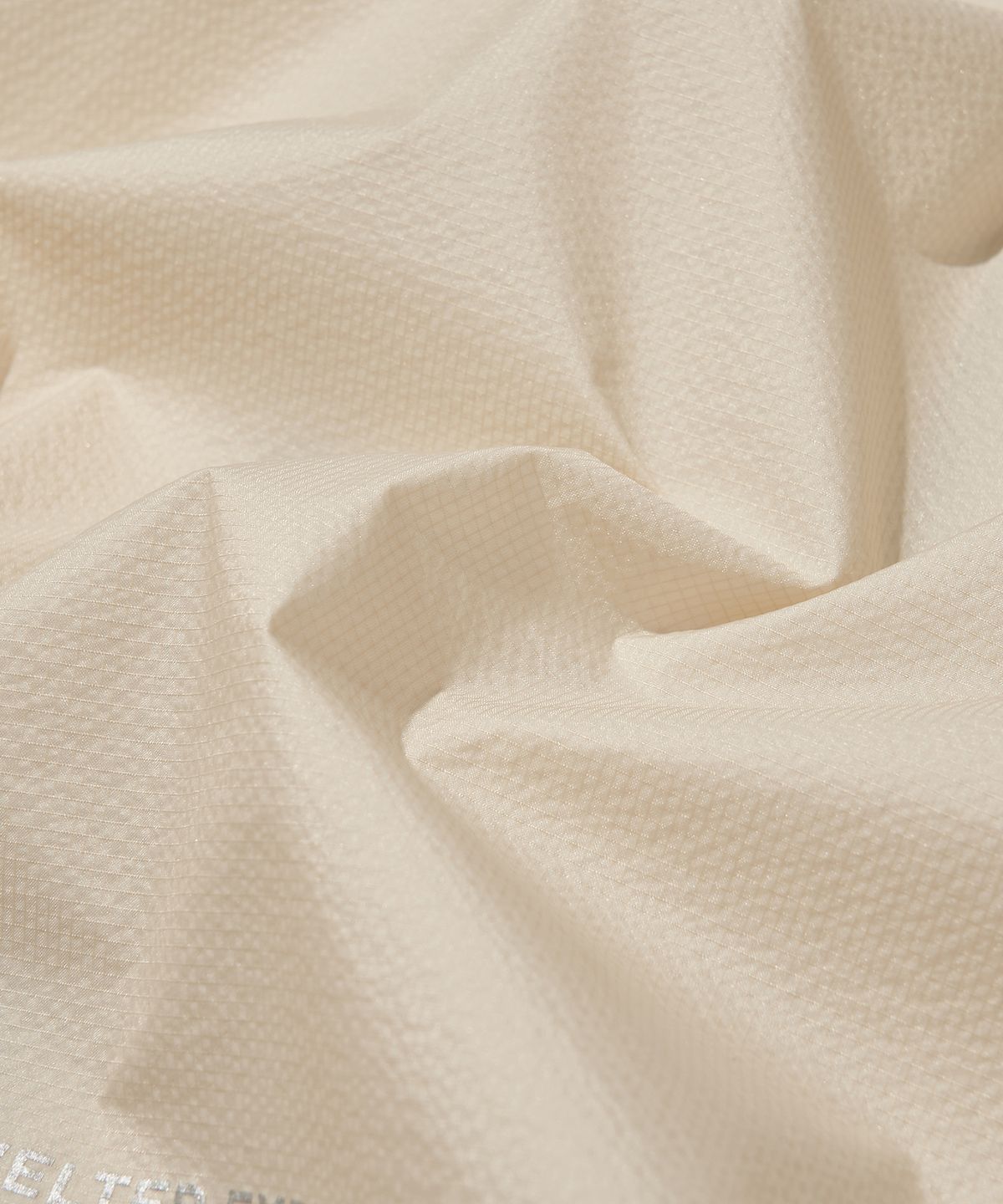 웰터 익스페리먼트(WELTER EXPERIMENT) VETRA SEALED WINDBREAKER JACKET_IVORY