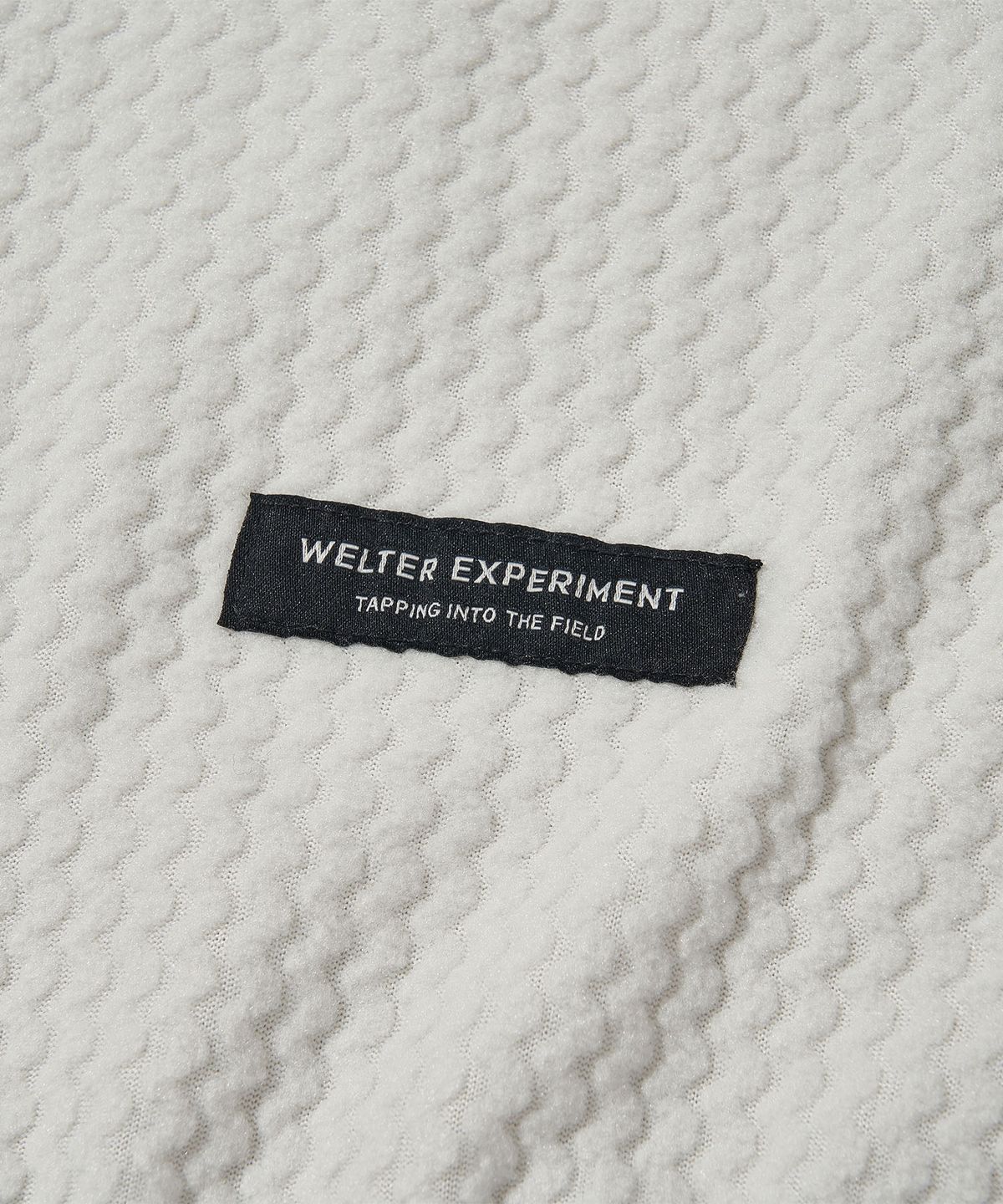웰터 익스페리먼트(WELTER EXPERIMENT) 칼로라 플리스 후디드 풀오버 화이트