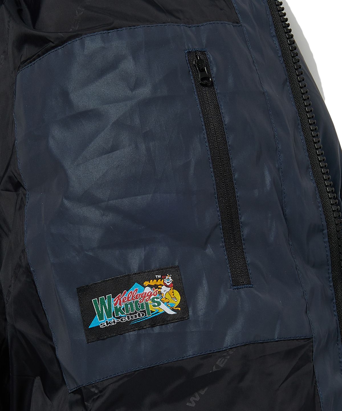 위캔더스(WKNDRS) KELLOGGS SPONSOR PUFFER JK (NAVY)