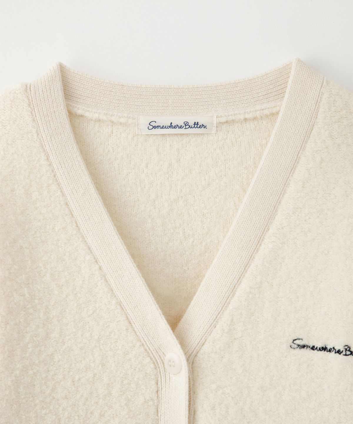썸웨어버터(SOMEWHEREBUTTER) Rima Boucle V-Neck Cardigan - Ivory